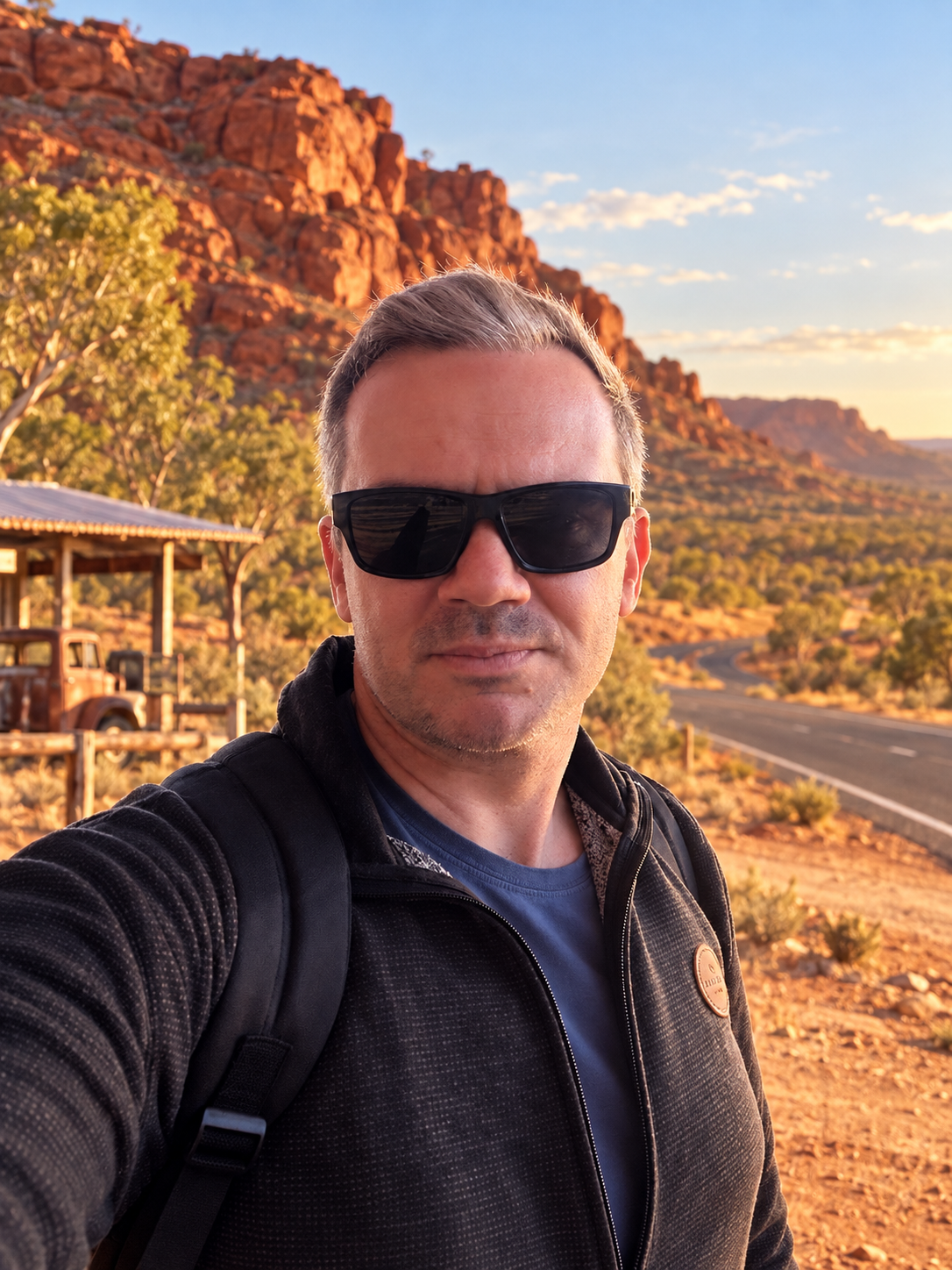 Phil from Team McQueen wearing sunglasses in an outback roadside setting